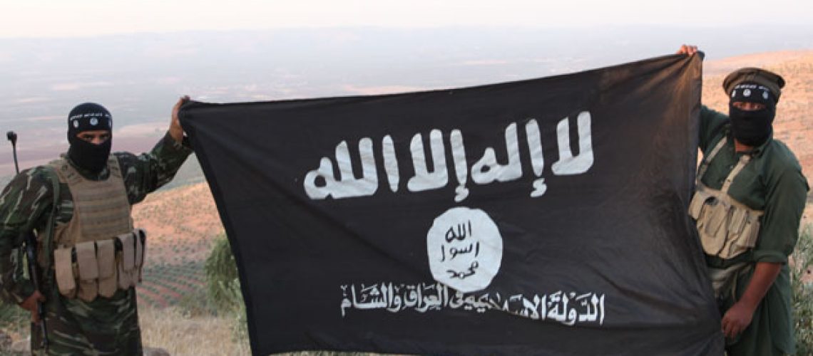 Oct 17, 2013 - Aleppo, Syria - ISIS fighters holding the Al-Qaeda flag with 'Islamic State of Iraq and the Levant' written on it. on the frontline. Islamic State of Iraq and the Levant aka ISIS. The group An-Nusra Front announced its creation January 2012 during the Syrian Civil War. Since then it has been the most aggressive and most effective rebel force in Syria. The group has been designated as a terrorist organization by the United Nations. April 2013, the leader of the ISIS released an audio statement announcing that Jabhat al-Nusra is its branch in Syria. (Credit Image: © Medyan Dairieh/ZUMA Wire/ZUMAPRESS.com)